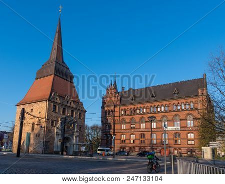 Rostock Germany - April 20. 2018: The Old City Gate Steintor And The Standahaus Building