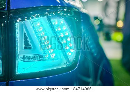 Luxury Blue Car Headlight Close-up. Concept Of Expensive, Sports Auto.  The Concept Of Tuning. Headl