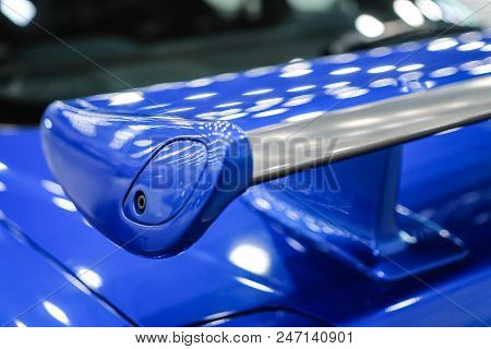 Blue Racing Spoiler On The Car Close-up. The Concept Of A Sports Car.