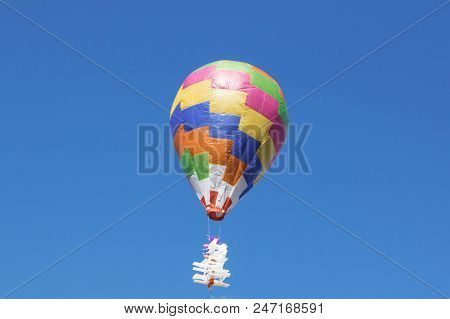 Hot Air Balloon Isolated On Beautiful Sky