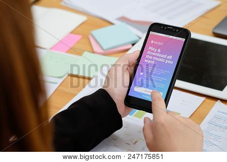 Chiang Mai,thailand - June 14,2018: A Woman Hand Holding Screen Shot Of Apple Music App Showing On N