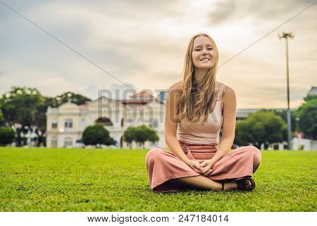 Woman On The Background Of Old Town Hall In George Town In Penang, Malaysia. The Foundation Stone Wa