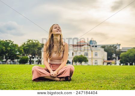 Woman On The Background Of Old Town Hall In George Town In Penang, Malaysia. The Foundation Stone Wa