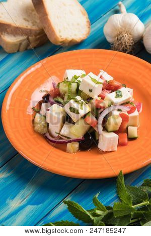 Greek salad with feta cheese cubes and fresk vegetables