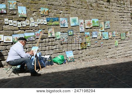 Street Painter Works On Long Leg Street, Tallinn, Estonia