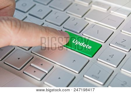 Computer Notebook Keyboard With Update Key - Technology Background. Update Inscriptions On The Grey 