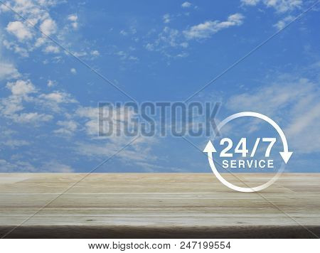24 Hours Service Icon On Wooden Table Over Blue Sky With White Clouds, Full Time Service Concept