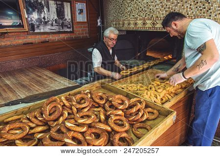 Istanbul, Turkey: Historical Bakery In Karakoy. Bakers In The Process Of Preparing Turkish Bagels Wi