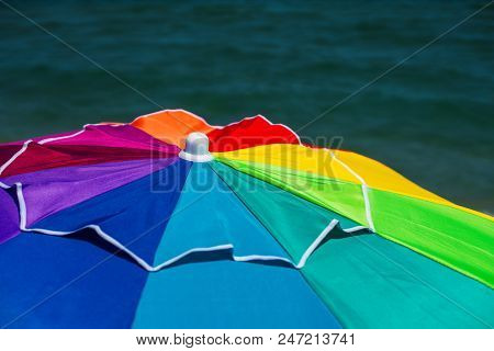 Colourful Umbrella On The Beach And Sea Water