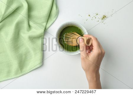 Woman Preparing Matcha Tea At Table, Top View