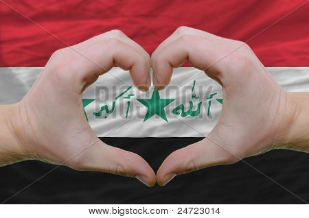 Heart And Love Gesture Showed By Hands Over Flag Of Iraq Background