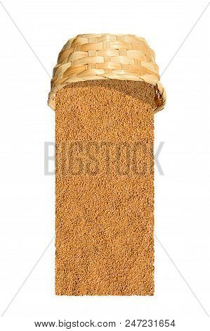 Yellow Indian Mustard Seeds (brassica Alba Boiss) Poured Out Of Wicker Basket Isolated On White Back