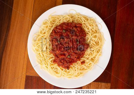 Pasta Puttanesca Plated And Photographed On Top