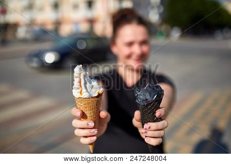 A First Person View, Girl Walking Along The Road, Holding Ice Cream In Her Hands And Eating It In Fr
