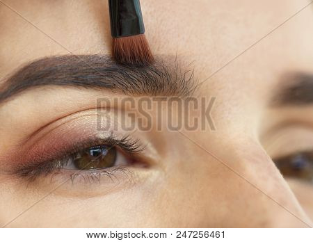 Makeup Eyebrows Close-up With A Soft Brush.