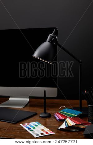 Close Up View Of Graphic Designer Workplace With Colorful Pallet, Graphic Tablet, Computer Screen An
