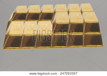 Stacked Bars Of Gold Bullion On A Gray Background.financial Concept