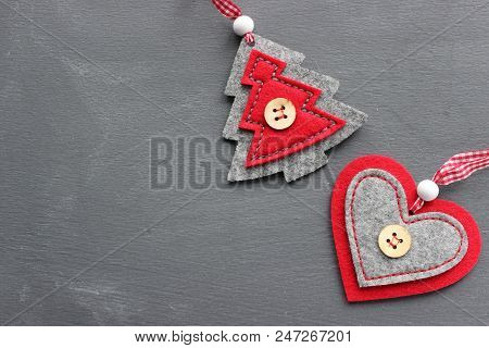 Christmas Textured Gray Background With Red Felt Toys. Free Space For Writing Texts