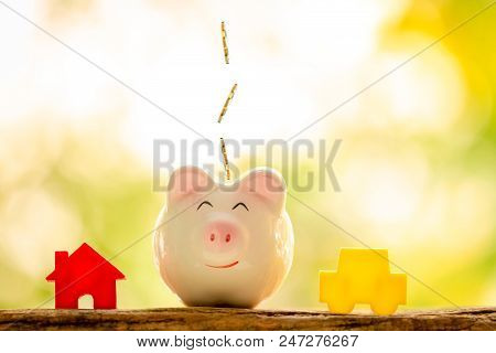 A House And Car Model And Piggy Bank For Loan Or Saving Money To Buy A New Real Estate And Chattel F