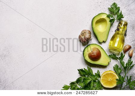 Food Background With Ingredients For Making Mexican Avocado Dip Guacamole.top View With Copy Space.