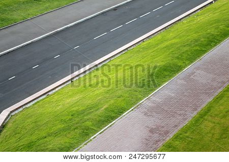Photo Of Road And Lawn Geometry On The Street