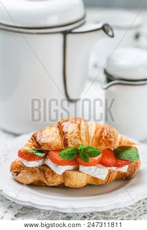 Croissant With Strawberries, Brie Cheese Or Camambert And Mint. Delicious Gourmet Breakfast. Selecti