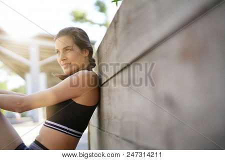 Fitness girl relaxing after exerciing