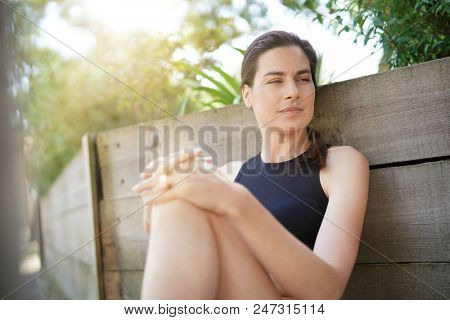 Fitness girl relaxing after exerciing