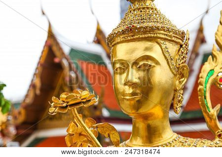 Golden Kinnari Statue  At Wat Phra Kaew ,the Temple Of Emerald Buddha In Bangkok, Thailand