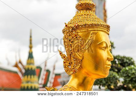 Golden Kinnari Statue  At Wat Phra Kaew ,the Temple Of Emerald Buddha In Bangkok, Thailand