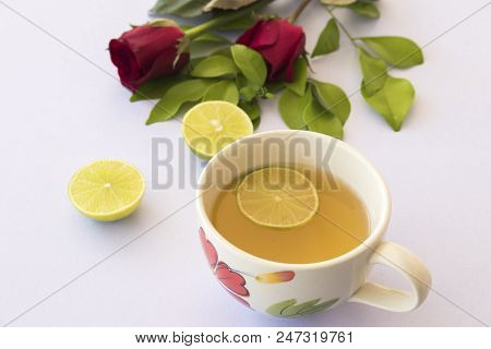 Herbal Health Care Hot Mix Honey Lemon And Cough Sore Throat Pastille With Red Rose Flower On Backgr