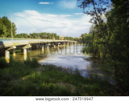 Summer Landscape. Automobile Bridge Over The River. Urban Landscape