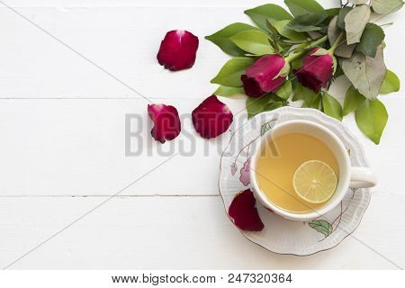 Herbal Health Care Hot Mix Honey Lemon And Cough Sore Throat Pastille With Red Rose Flower On Backgr