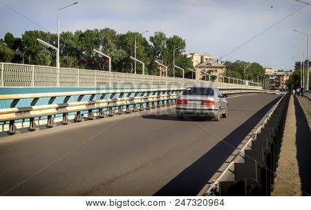 Kazakhstan, Ust-kamenogorsk, June 24, 2018: The Car On The Bridge Over The Ulba River. Urban