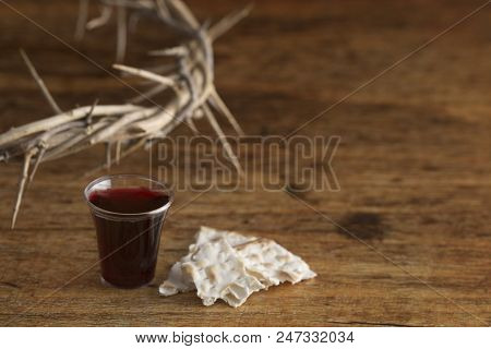 Christian Communion On A Wooden Table With A Crown Of Thorns