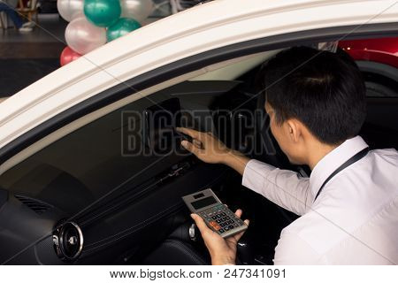 This Asian Man Calculating Calculator In Car Career Saleman For Business Finance On Car Showroom Blu