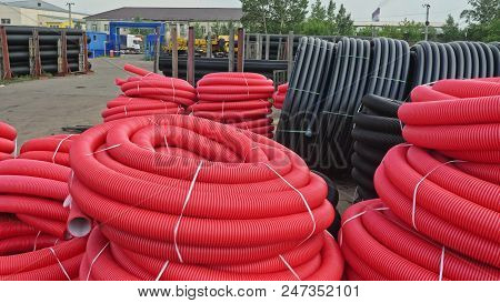 Warehouse Of Finished Plastic Pipes Industrial Outdoors Storage Site. Manufacture Of Plastic Water P