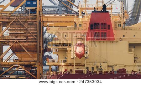 General Cargo Ship - Transhipment Of A Freighter At The Quay In Swinoujscie