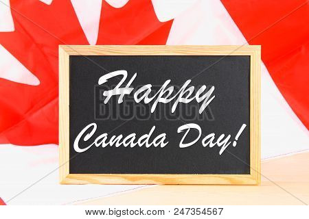 Chalkboard With The Word Happy Canada Day On The National Flag. Feast Of 1 July
