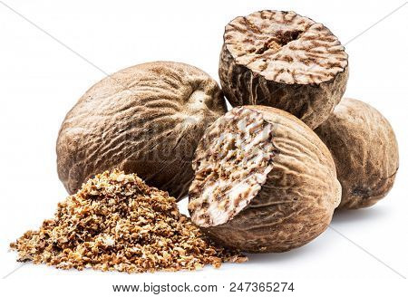 Dried seeds of fragrant nutmeg and grated nutmeg  isolated on white background.