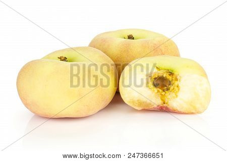 Two Fresh Ripe Saturn Peaches With One Half Isolated On White Background