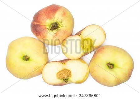 Three Fresh Ripe Saturn Peaches And One Cut In Two Halves Top View Isolated On White Background