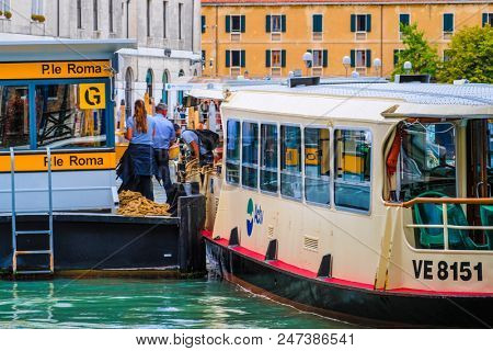 Venice, Italy - June, 28: Regular-route swimming bus on a channel in Venice, Italy