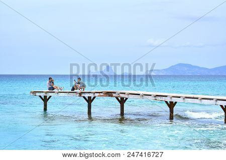 Formentera Island, Spain - May 4, 2018: People Taking A Picture In The Wooden Boardwalk, Picturesque