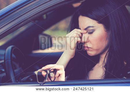 Business Woman Having Headache Taking Off Her Glasses Has To Make A Stop After Driving Car On Rush H