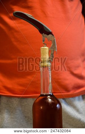 Opener Vine Close-up.corkscrew And Bottle Of Vine On The Board.bottle Of Wine With Corkscrew.setting