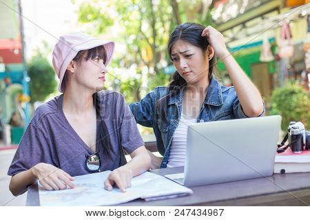 Portrait Of Traveler Woman In City. Asian Women Using Map And Laptop For Seach Location, People With