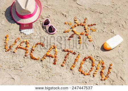 Inscription Vacation Made Of Amber Stones, Accessoriess For Sunbathing And Passport With Currencies 