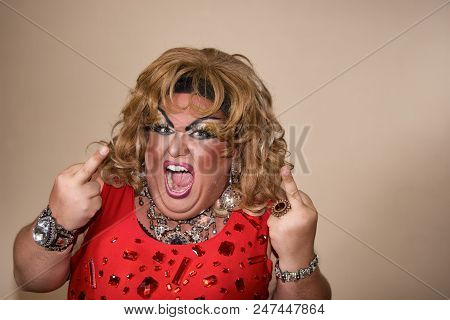 Funny Travesty Actor. Drag Queen In Red. Feelings And Emotions. Fat Man And Make-up
