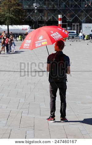 Copenhagen, Denmark - June 27, 2018: One Of Sandemans Free Tour Guides Under His Red Umbrella At The